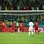 Home 11 바레인의 유명한 사건 - **Prompt for 2007 Asian Cup 'Bahrain Shock'**:
"A vibrant, emotionally charged football stadium ...